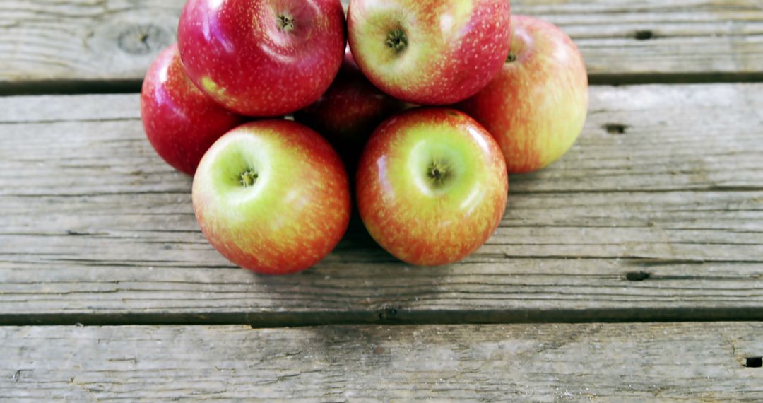 Fresh Red Apples Arranged on Rustic Wooden Surface - Free Images, Stock Photos and Pictures on Pikwizard.com