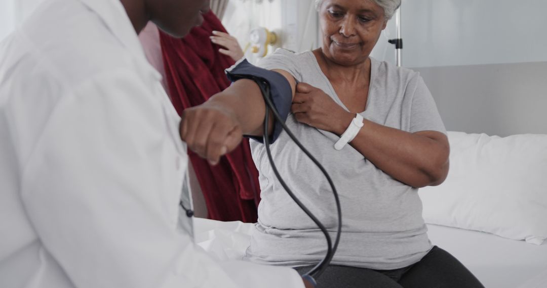 Healthcare Professional Measuring Blood Pressure of Elderly Patient - Free Images, Stock Photos and Pictures on Pikwizard.com