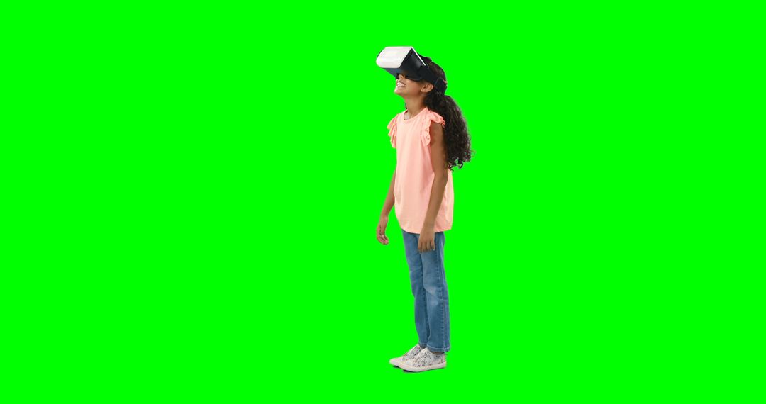 Girl Immersed in Virtual Reality Experience Against Green Screen