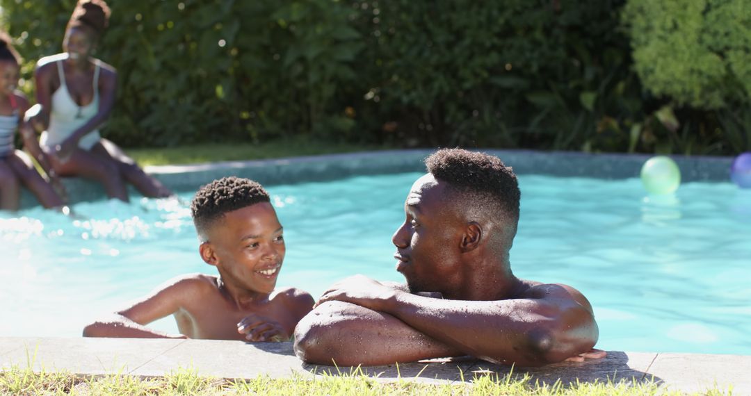 Father and Son Enjoying Quality Time in Swimming Pool