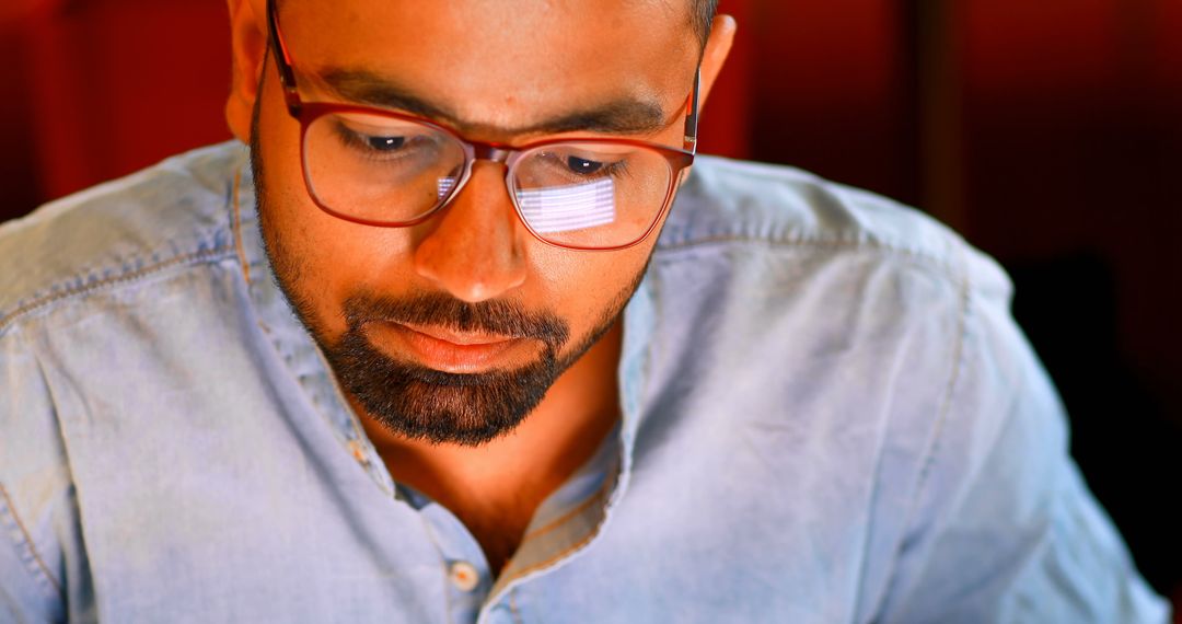 Focused Professional in Office Working Late