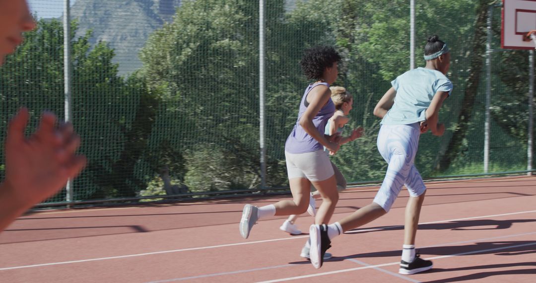 Multiracial Teenagers Running on Outdoor Track - Free Images, Stock Photos and Pictures on Pikwizard.com