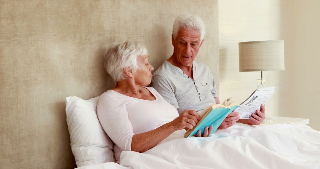 Senior Couple Relaxing in Bed Reading Books - Free Images, Stock Photos and Pictures on Pikwizard.com