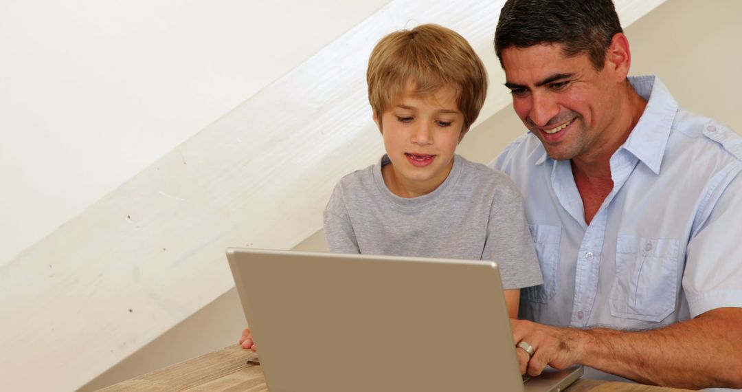 Father and Son Bonding Time Using Laptop Together - Free Images, Stock Photos and Pictures on Pikwizard.com