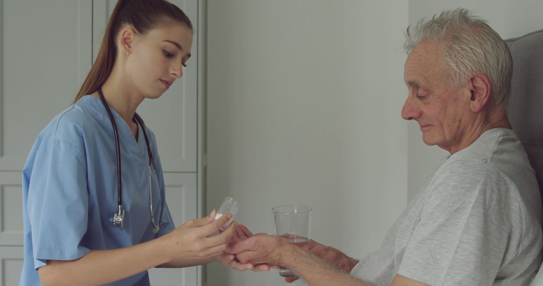 Healthcare Worker Assisting Elderly Patient With Medication - Free Images, Stock Photos and Pictures on Pikwizard.com