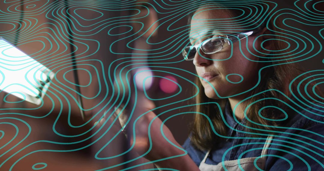 Creative Professional Working in Low Light, Focusing Intently