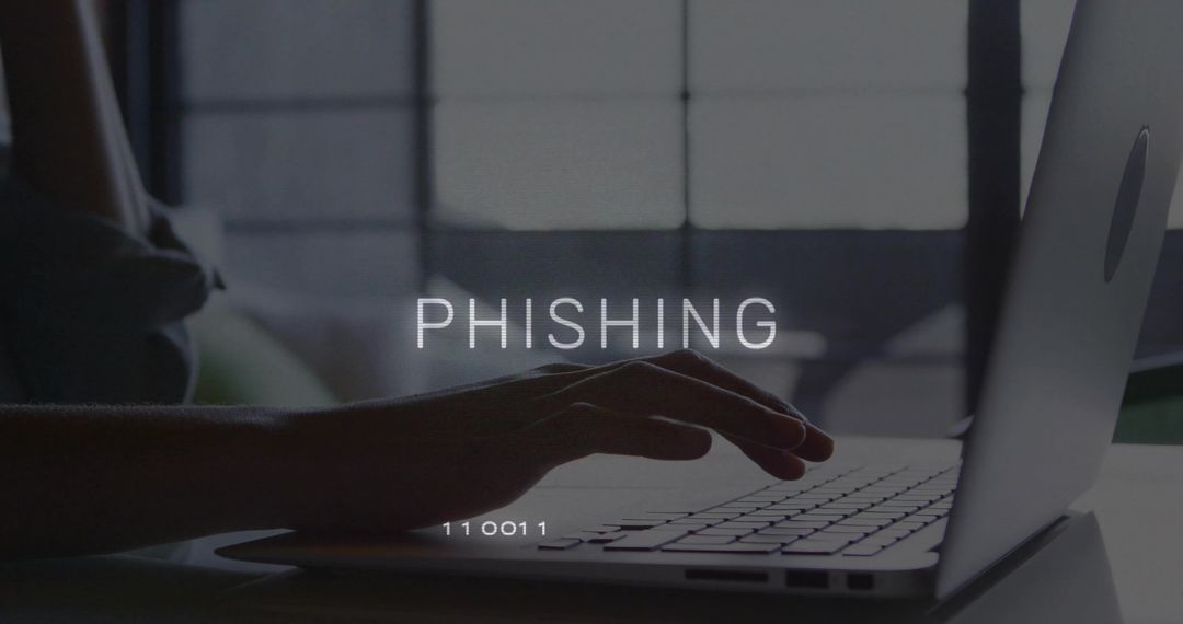 Phishing concept showing typing hands on laptop