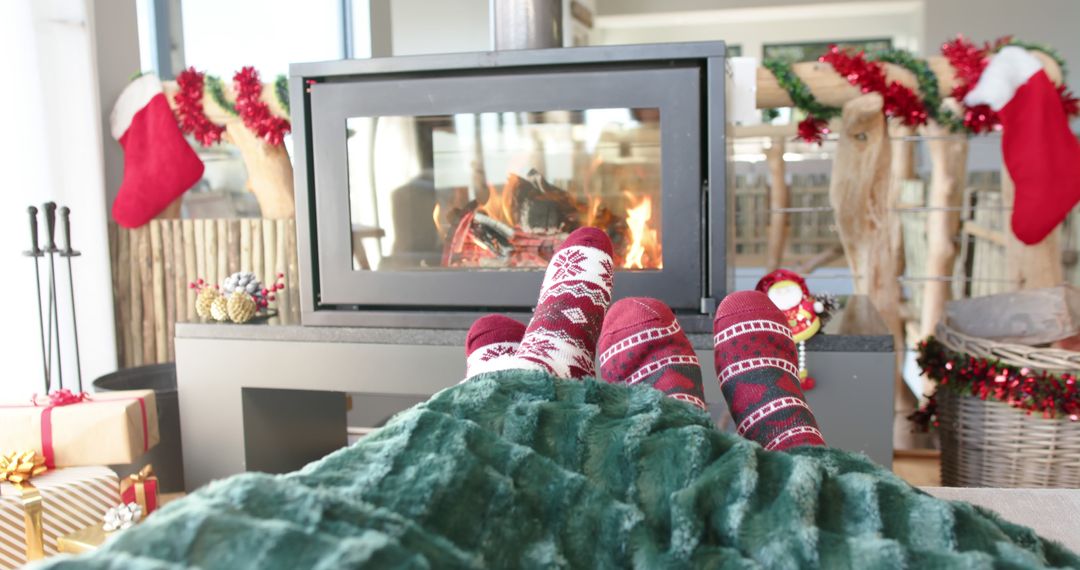 Cozy Feet by Fireplace During Christmas Season - Free Images, Stock Photos and Pictures on Pikwizard.com