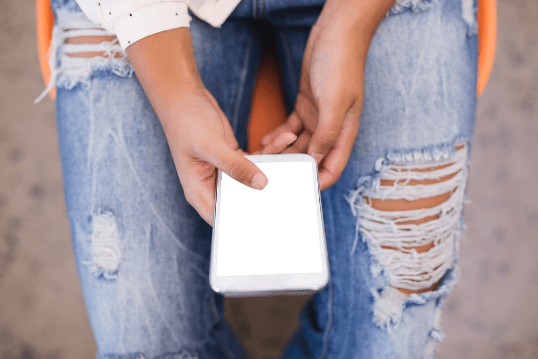 Transparent Smartphone Usage in Ripped Jeans Close-Up