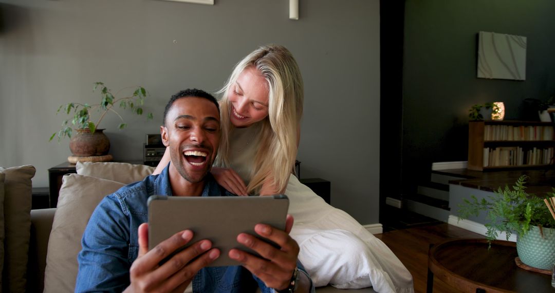 Couple Sharing Engagement News via Video Call at Home