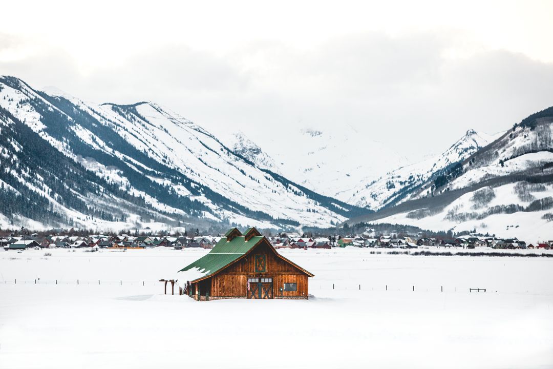 Idyllic Mountain Barn in Serene Snow-Capped Wilderness