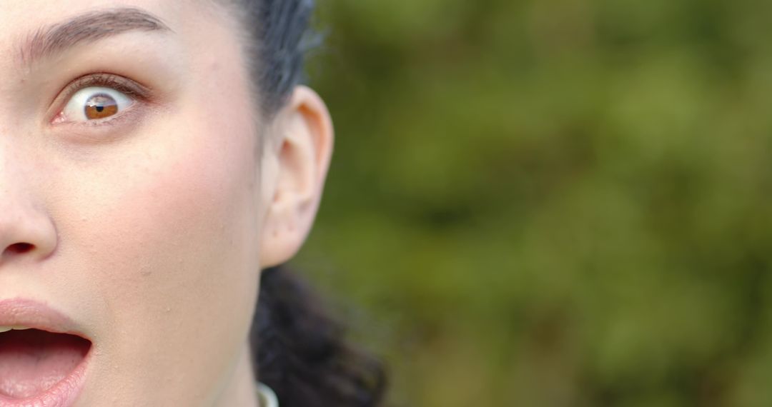 Close-Up of Woman Outdoors with Surprised Expression