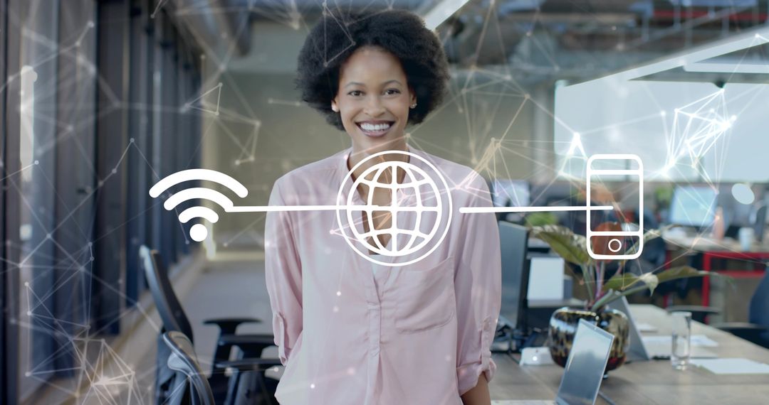 Smiling professional connecting laptop and smartphone to Wi-Fi in modern open office