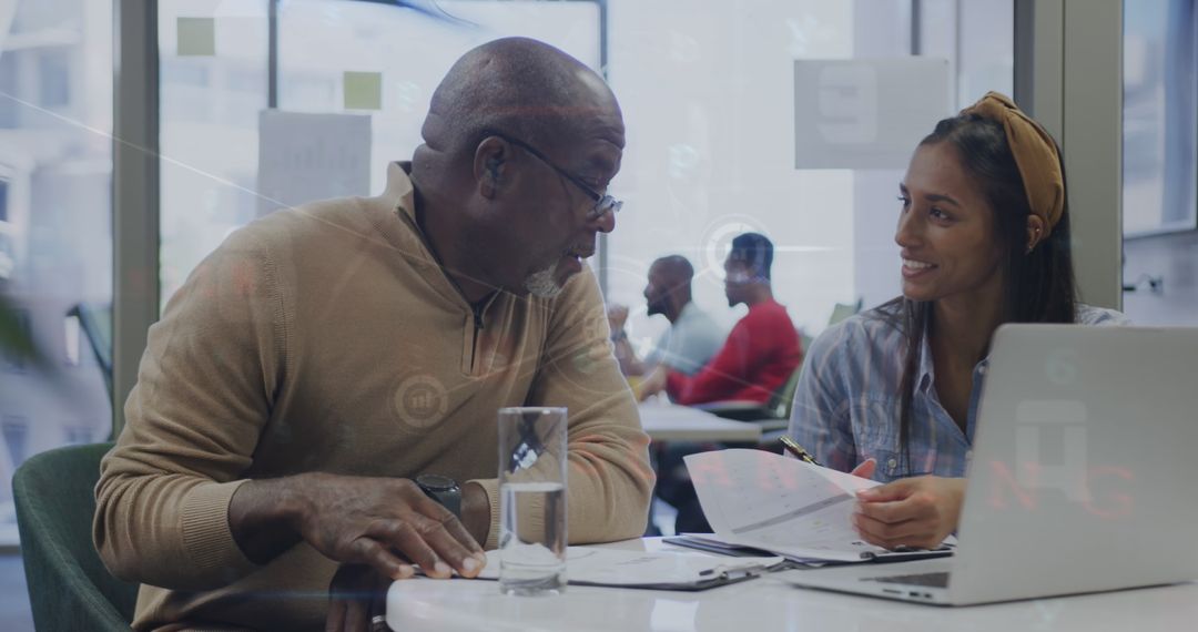 Diverse Professionals Working on Financial Data in Office Setting