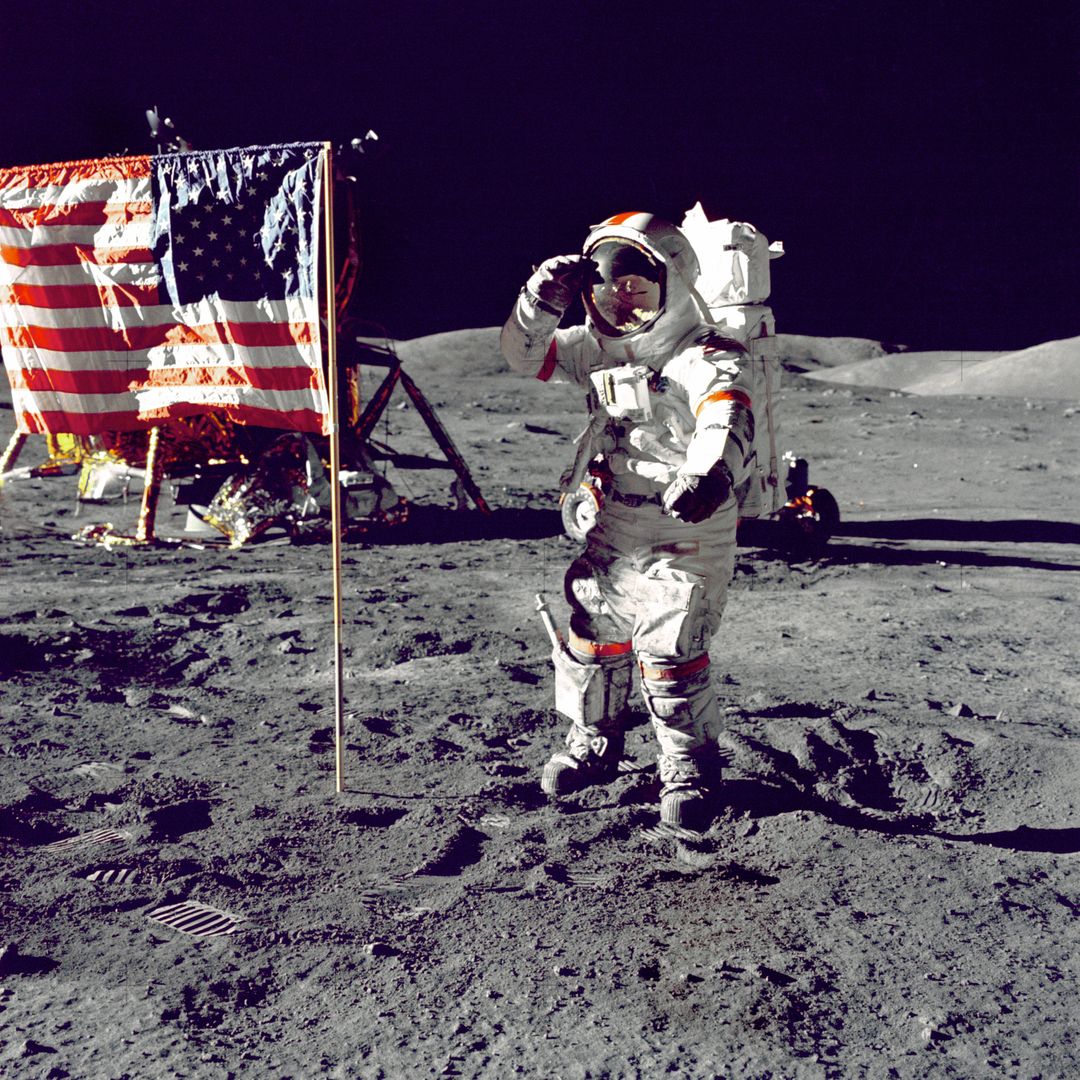 Astronaut Saluting American Flag on Lunar Surface During Moon Mission - Free Images, Stock Photos and Pictures on Pikwizard.com