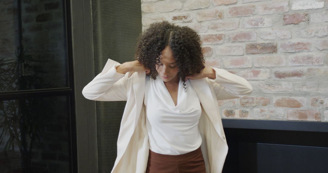 Confident Businesswoman Wearing Stylish White Blazer in Modern Office - Free Images, Stock Photos and Pictures on Pikwizard.com