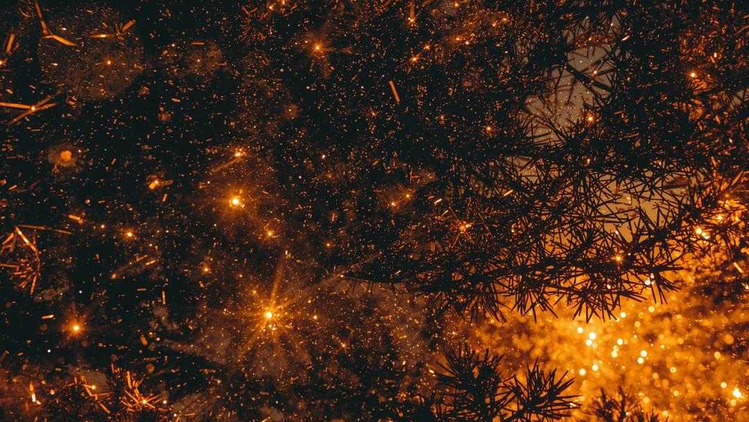 Glistening Evergreen Branch with Golden Sparkles and Leaves