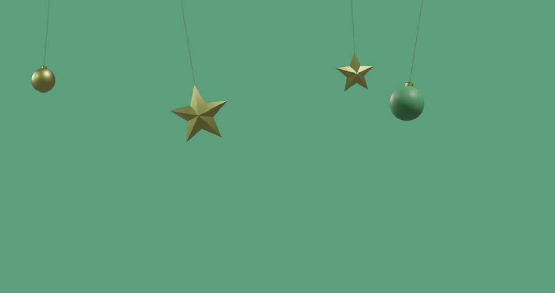 Hanging Christmas Ornaments on Green Background with Copy Space
