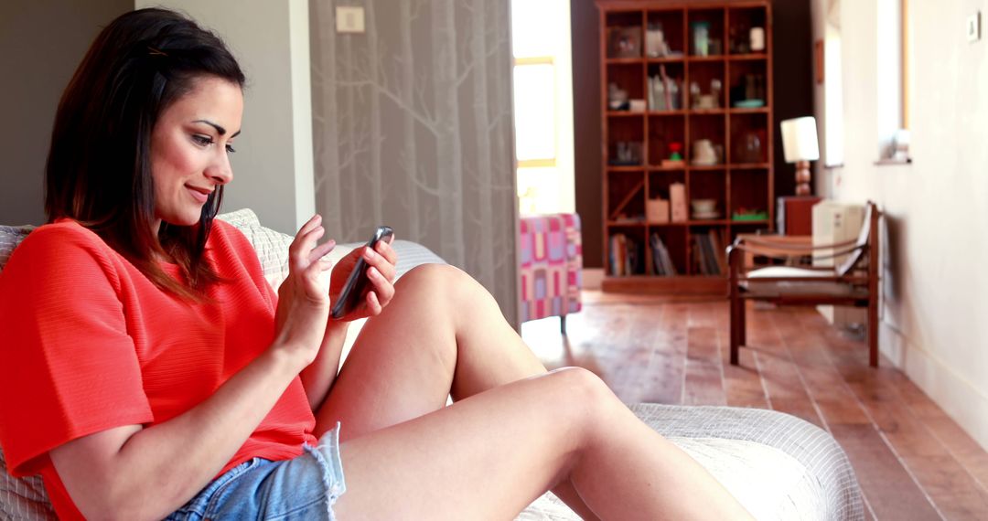 Woman Relaxing at Home Using Smartphone - Free Images, Stock Photos and Pictures on Pikwizard.com