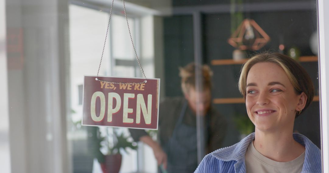 Small Business Owner Smiling Next to Open Sign at Shop Entrance - Free Images, Stock Photos and Pictures on Pikwizard.com