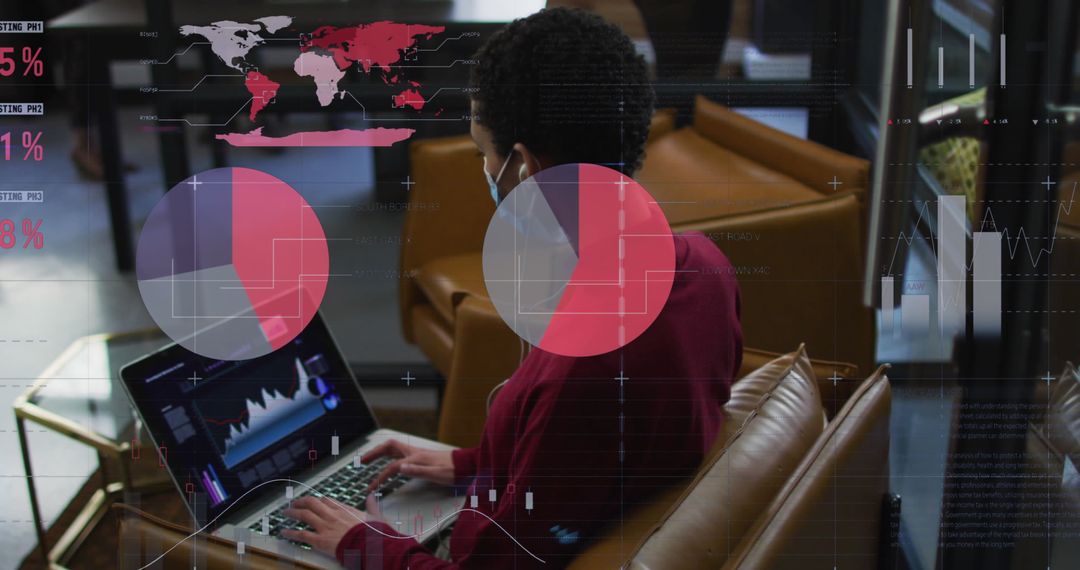 Analyst Examining Data Visualizations on Laptop in Office