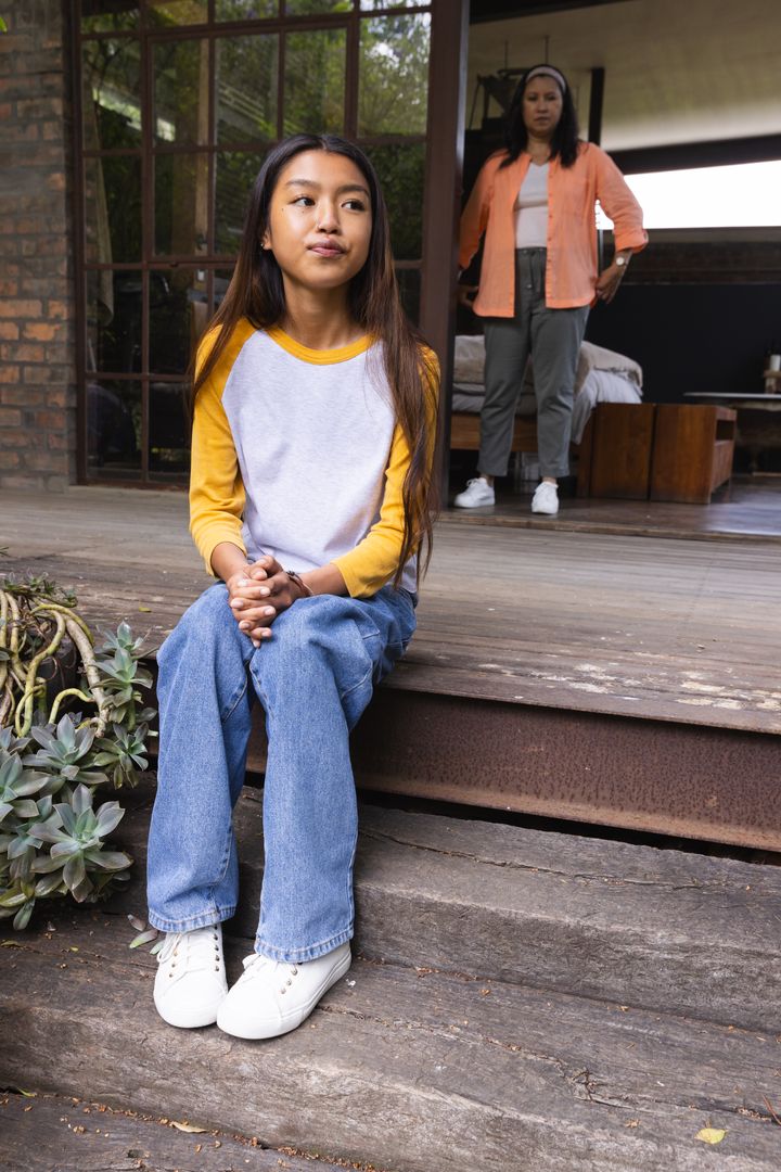 Mother and Daughter Connecting on Rustic Home Porch