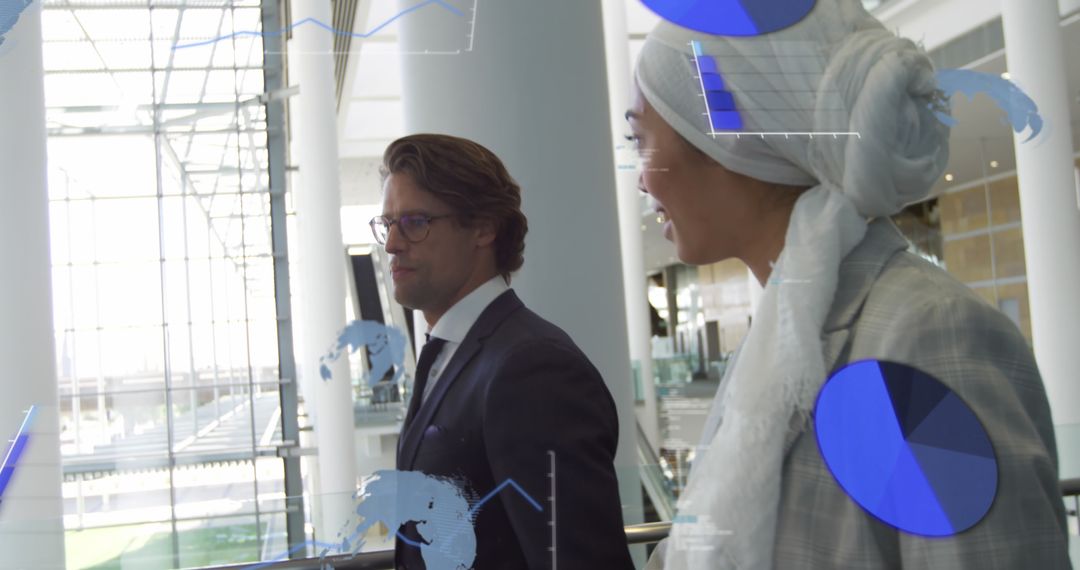 Diverse Business Professionals in Modern Office Analyzing Digital Financial Data