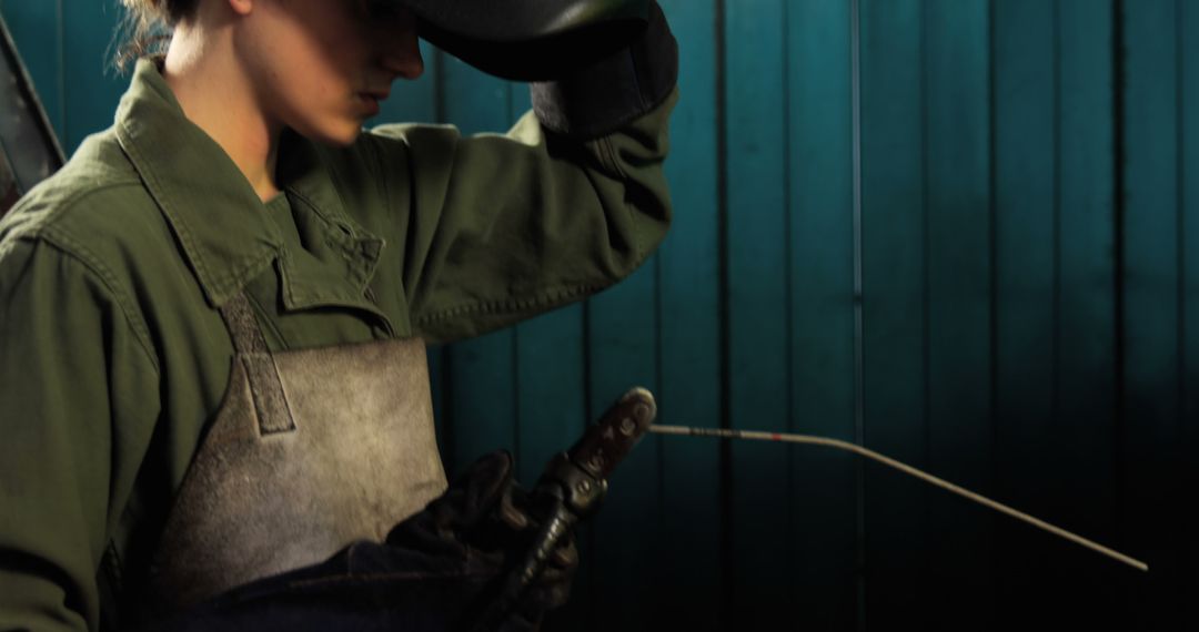 Female Welder Working with Welding Torch - Free Images, Stock Photos and Pictures on Pikwizard.com