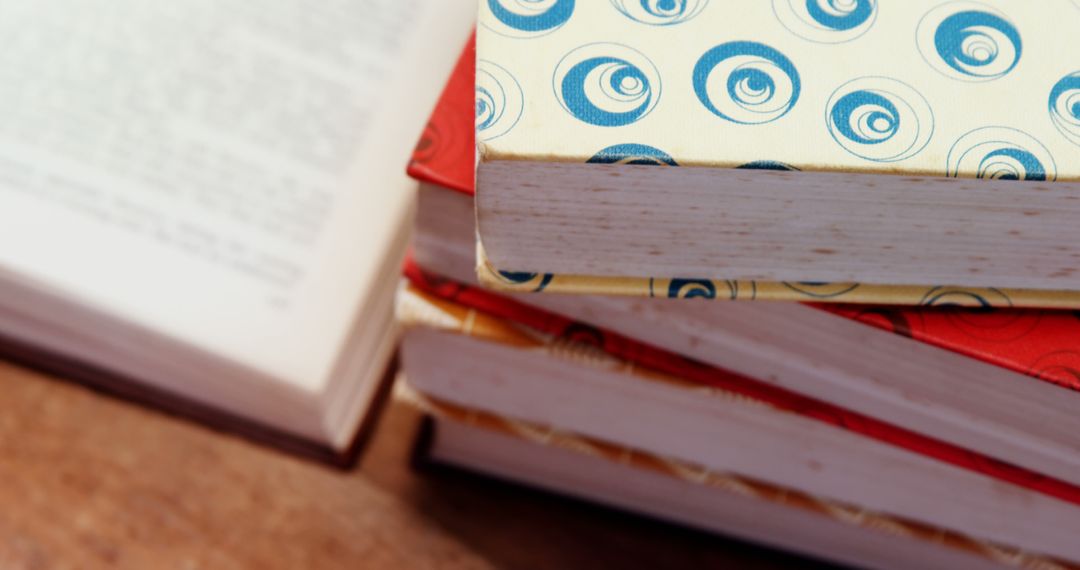 Stack of Vintage Books with Decorative Covers on Wooden Surface - Free Images, Stock Photos and Pictures on Pikwizard.com