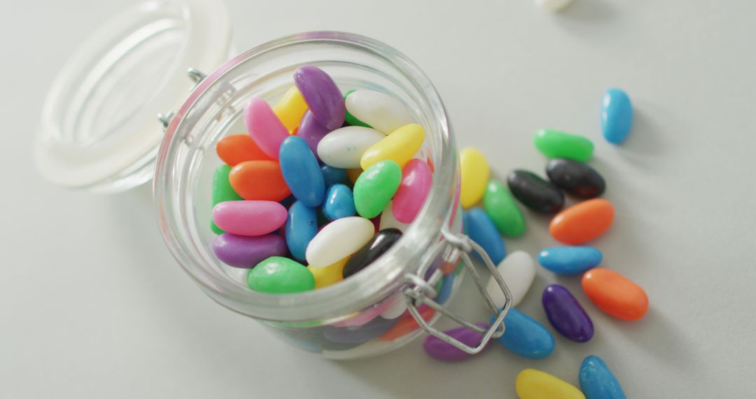 Colorful Jelly Beans in Glass Jar on Light Background - Free Images, Stock Photos and Pictures on Pikwizard.com