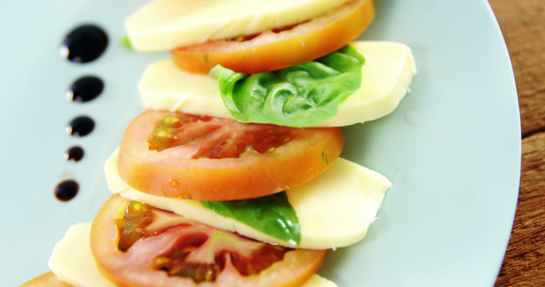 Fresh Caprese Salad with Tomatoes, Mozzarella, and Basil on Plate - Free Images, Stock Photos and Pictures on Pikwizard.com