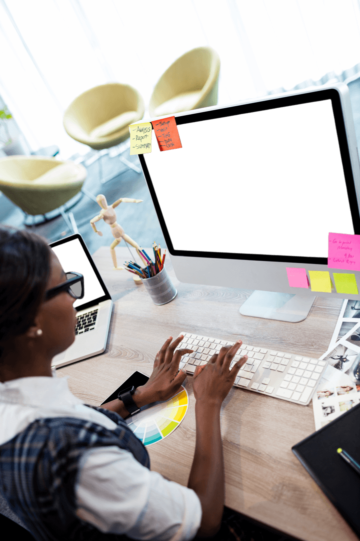 Woman Office Worker Engaged in Creative Desk Task with Transparent Screen