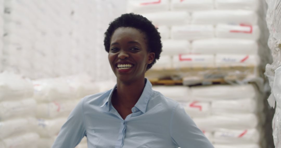 Smiling African American Warehouse Manager Organizing Storage