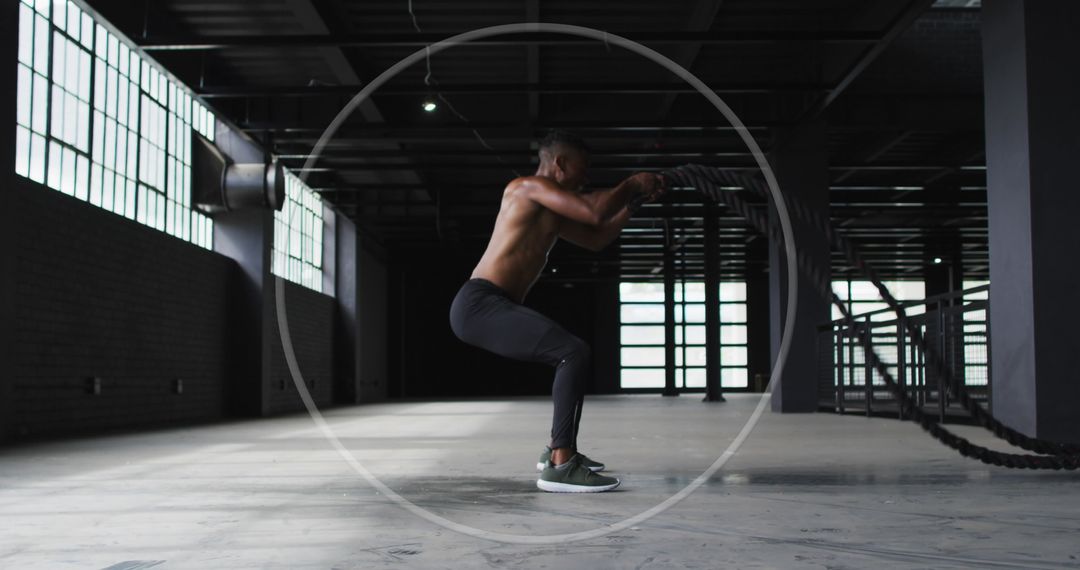 Man Exercising Indoors with Pushups in Urban Gym Setting