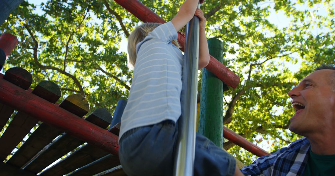 Father and Son Enjoying Playground on Sunny Day - Free Images, Stock Photos and Pictures on Pikwizard.com