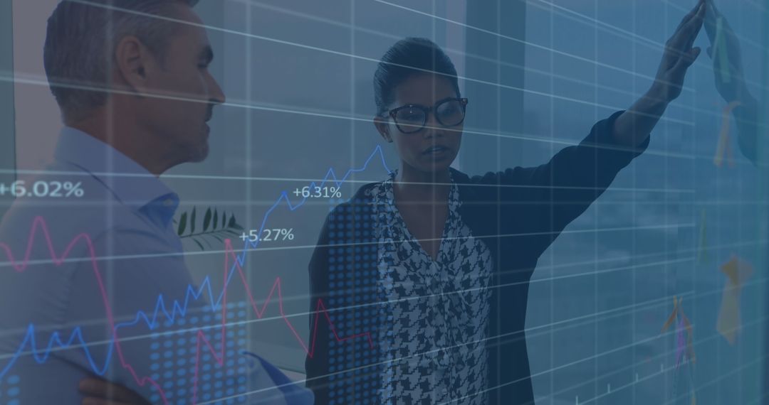 Diverse Team Analyzing Growing Financial Charts On Screen