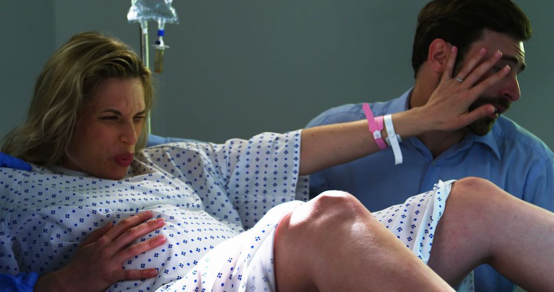 Woman in Labor Schreiking while Partner Offers Support in Hospital Ward - Free Images, Stock Photos and Pictures on Pikwizard.com