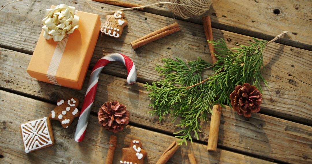 Rustic Christmas Decorations and Gift on Wooden Table - Free Images, Stock Photos and Pictures on Pikwizard.com