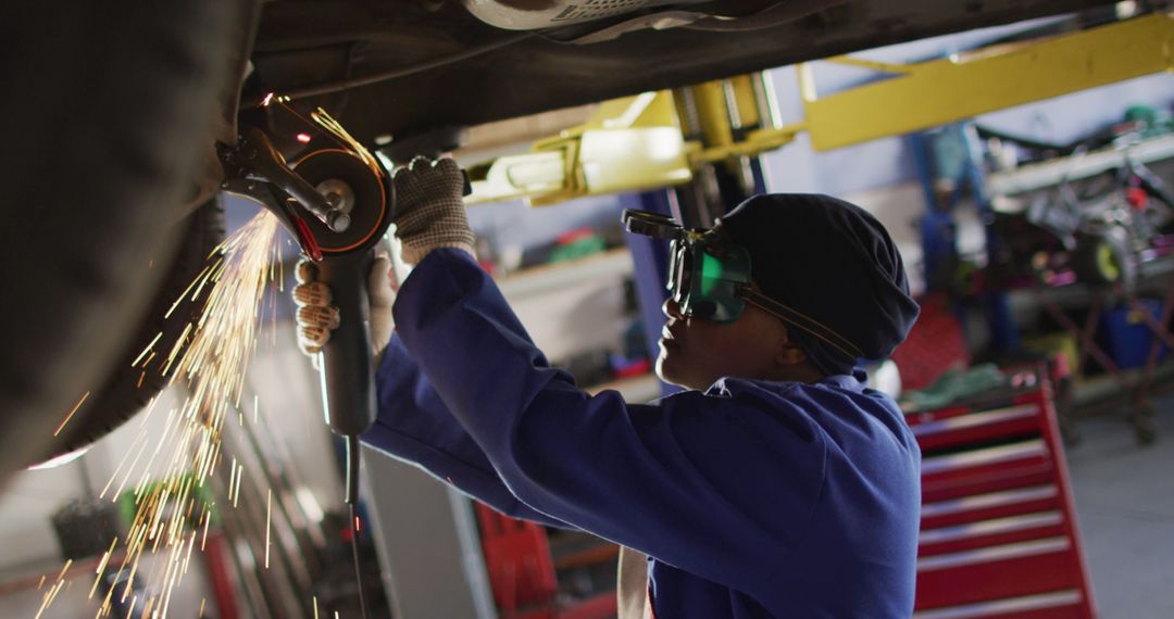 Worker Uses Angle Grinder in Auto Repair Shop, Sparks Flying - Free Images, Stock Photos and Pictures on Pikwizard.com