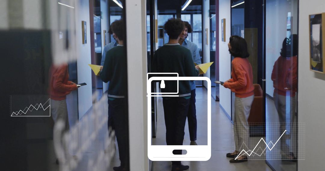 Diverse Colleagues Engaging in Business Discussion with Digital Interface Graphics