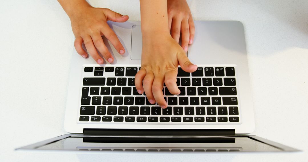 Child Typing on Laptop Keyboard - Free Images, Stock Photos and Pictures on Pikwizard.com