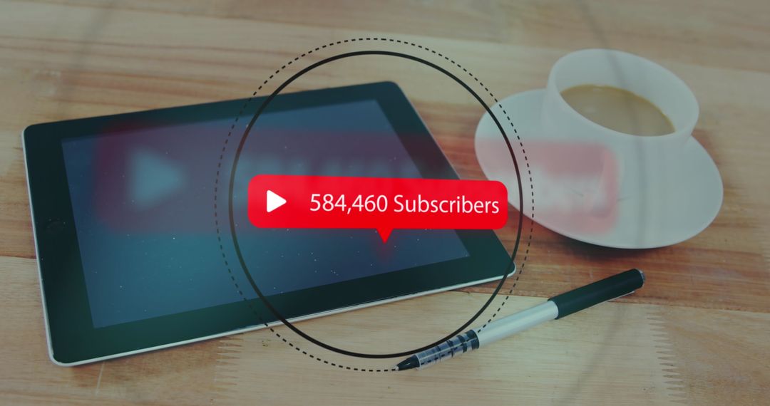 Growing Subscriber Count on Tablet with Coffee and Pen