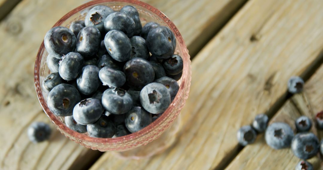 Fresh Blueberries in Glass Bowl on Wooden Table - Free Images, Stock Photos and Pictures on Pikwizard.com