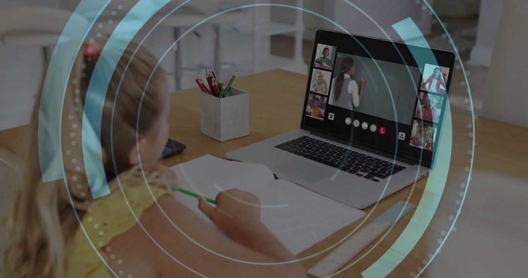 Girl Engaged in Online Class with Laptop and Notebook on Kitchen Table