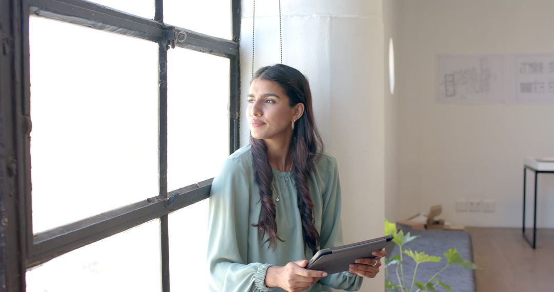 Professional Woman Contemplating Ideas in Modern Office with Tablet