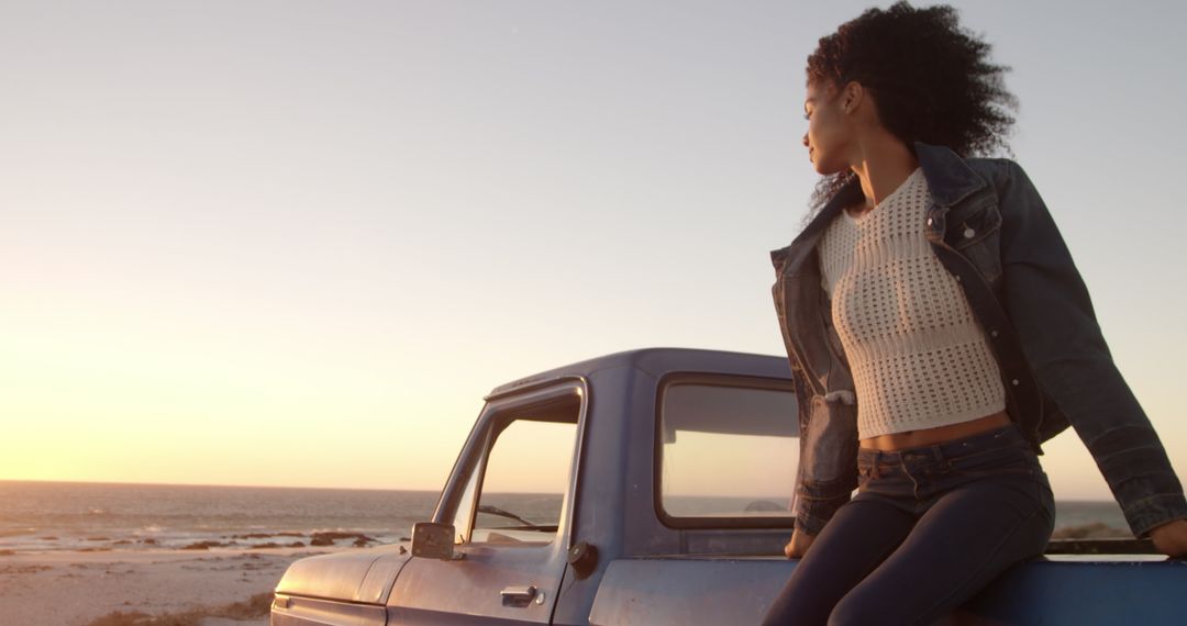 Young Woman Relaxing on Edge of Pickup Truck at Sunset Beach - Free Images, Stock Photos and Pictures on Pikwizard.com