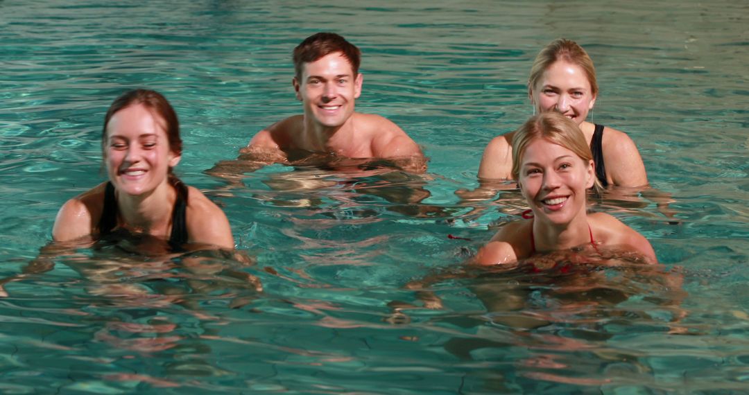 Group of Smiling Friends Enjoying Indoor Swimming Pool - Free Images, Stock Photos and Pictures on Pikwizard.com