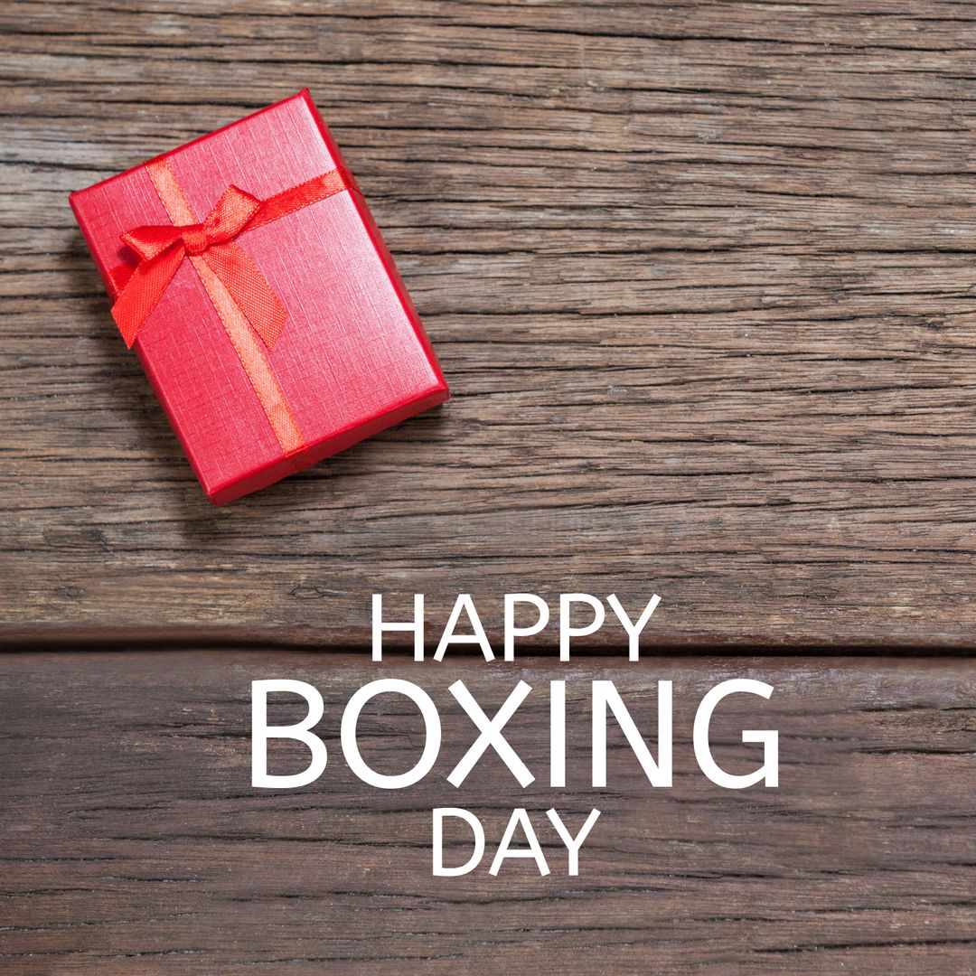 Boxing Day Celebration with Red Gift on Rustic Wood Background