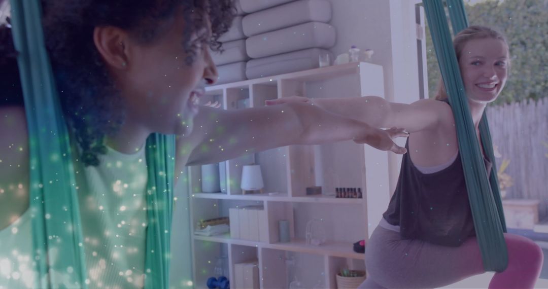 Teenagers Practicing Aerial Yoga With Glowing Green Particles