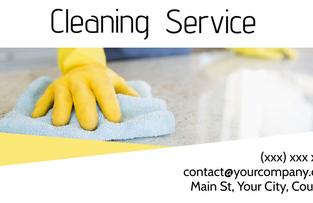Hand in yellow glove cleaning surface for hygiene and cleanliness
